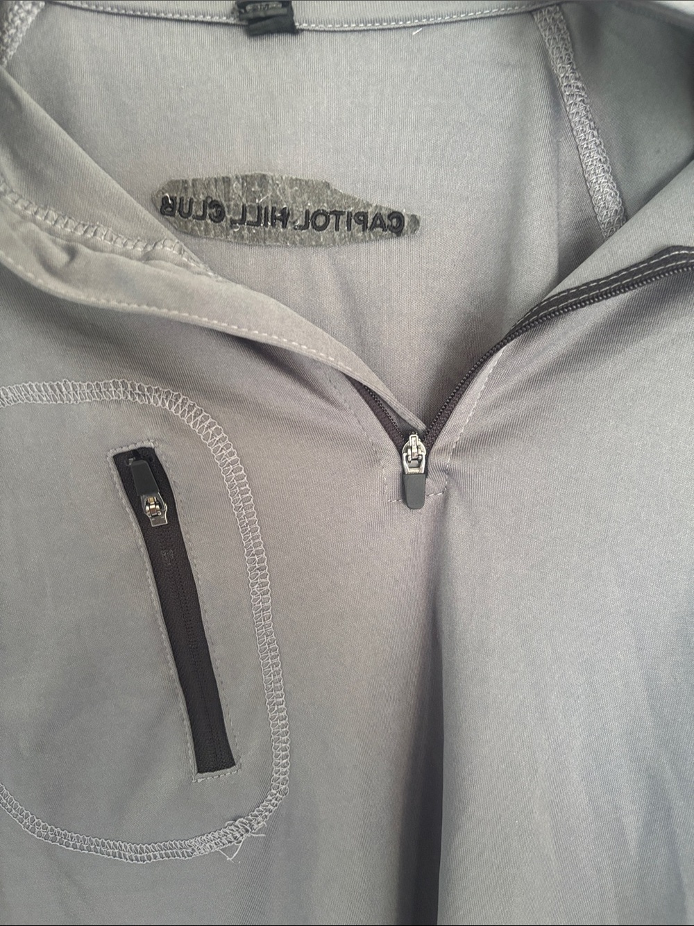 Dunbrooke Light Gray Zip-Up Sweater with Chest Pocket. Capital Hill Club Logo.